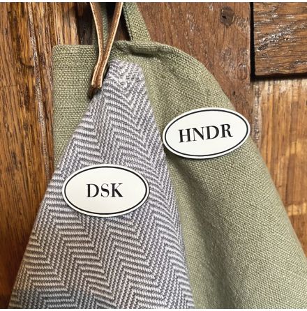 Skylt med frkortningar av orden Hnder och Disk
